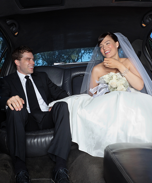 woman getting out of the backseat of a car